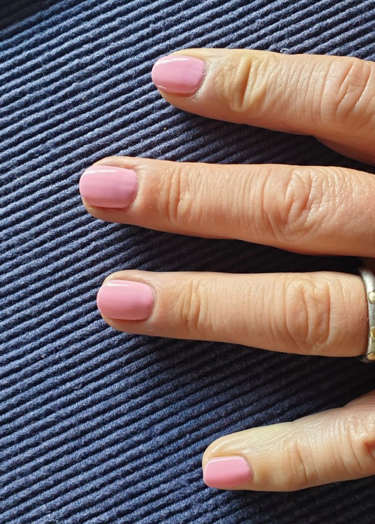 pink painted fingernails